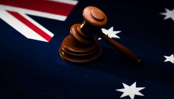 Gavel sitting on top of textured Australian flag