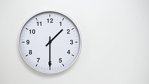 istock Minimalist White Clock with Silver Frame Striking  on White Background  Perfect for Time Management and Corporate Campaigns 2173832964