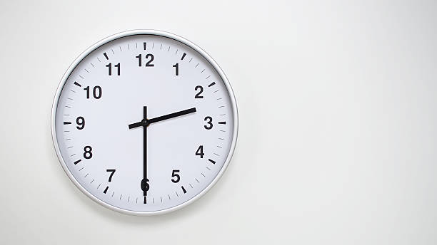 istock Minimalist White Clock with Silver Frame Striking  on White Background  Perfect for Time Management and Corporate Campaigns 2173833031