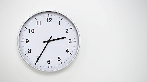 istock Minimalist White Clock with Silver Frame Striking  on White Background  Perfect for Time Management and Corporate Campaigns 2173833036