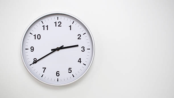 istock Minimalist White Clock with Silver Frame Striking  on White Background  Perfect for Time Management and Corporate Campaigns 2173833047