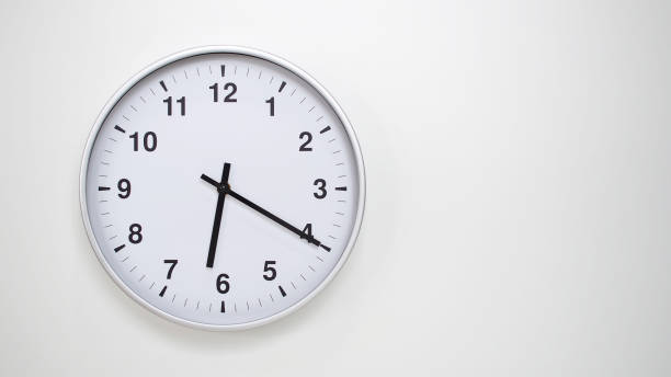 istock Minimalist White Clock with Silver Frame Striking  on White Background  Perfect for Time Management and Corporate Campaigns 2173833518
