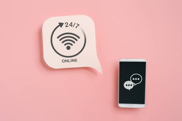 For call center, customer and online service without interruption day and night, real white speech bubble paper cut  with 24 hours service sign and mobile phone with chat icon on pink background