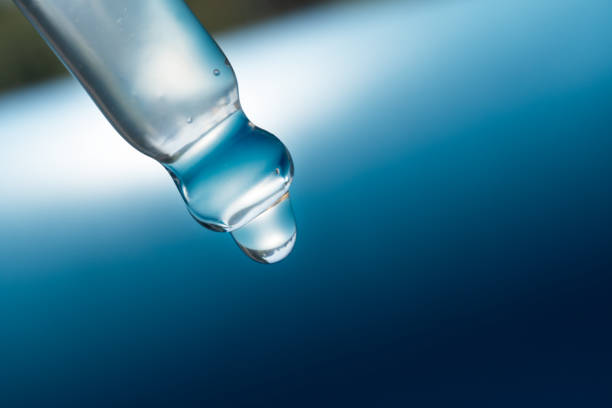 pipette with a drop of cosmetic product