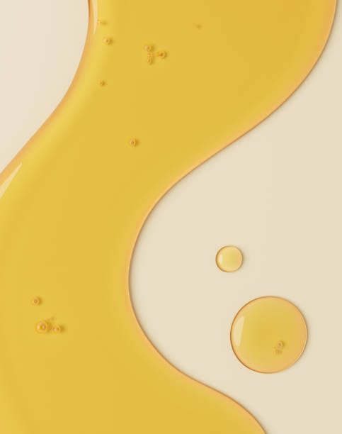 smooth yellow liquid with a glossy, oily texture on a beige background. The liquid forms a flowing wave-like shape with small bubbles, evoking associations with oils, serums, or cosmetic products. 3d rendering