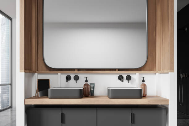 istock Home bathroom interior with double sink, accessories and panoramic window 2173865741