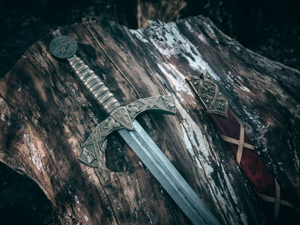 istock A beautiful medieval sword with a bronze hilt and red scabbard. 2173867517