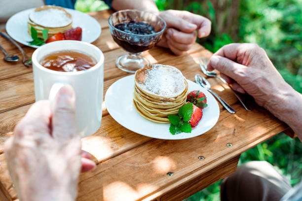 istock Senior couple enjoying a peaceful morning with breakfast and tea 2173868788