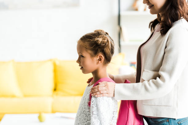 istock Mother supporting her daughter with backpack ready for school 2173870733