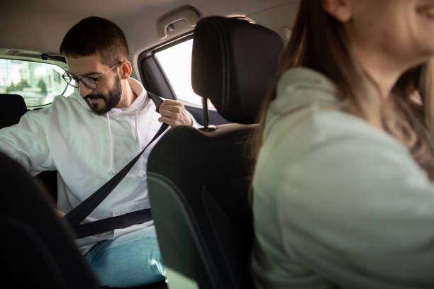 istock Man riding passenger in a car 2173871216