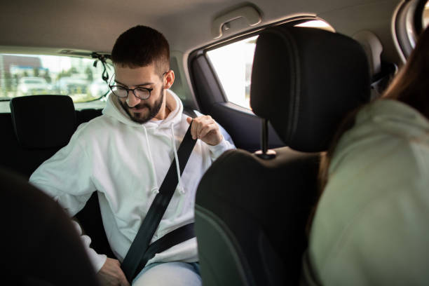 istock Man riding passenger in a car 2173871217