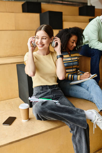 istock Diverse students sitting on the university staircase during a study break 2173873651