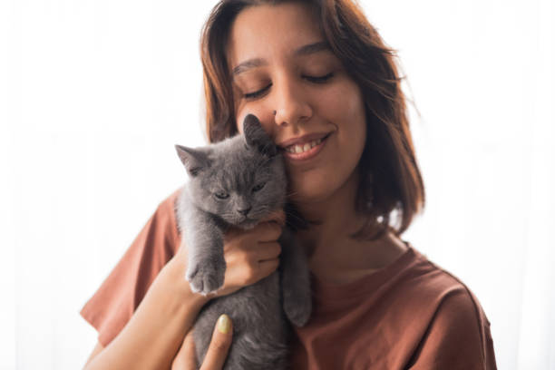 istock Young Woman And Kitten 2173876856