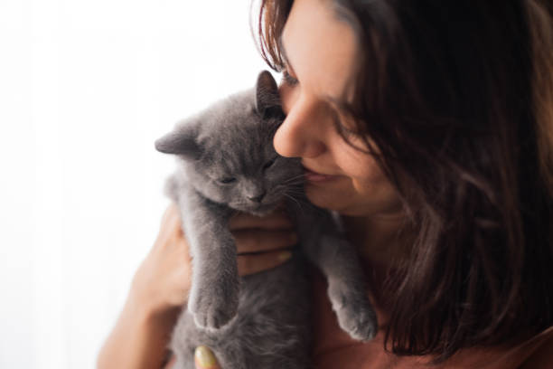 istock Young Woman And Kitten 2173876901