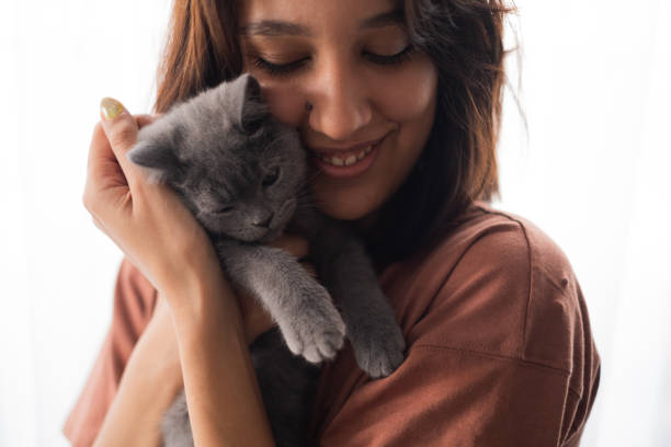 istock Young Woman And Kitten 2173876931