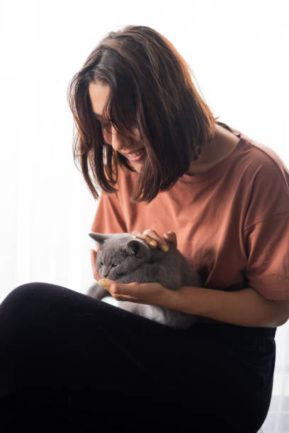 istock Young Woman And Kitten 2173876962