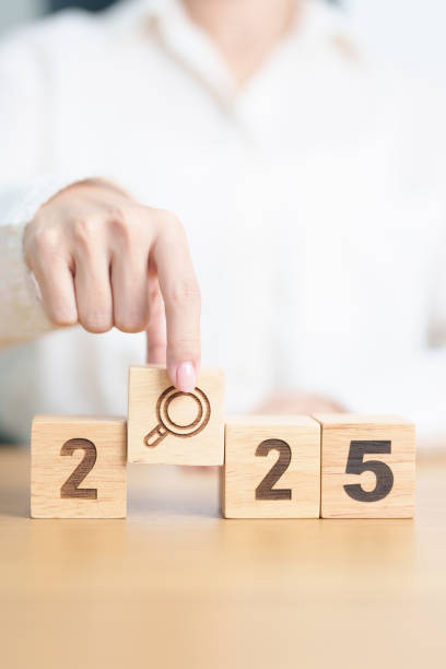 istock 2025 block with magnifying glass icon. SEO, Search Engine Optimization, hiring , Advertising, Idea, Strategy, marketing, Keyword, Content and New Year start concepts 2173877004