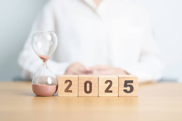 istock Happy New Year 2025 with hourglass on table. Resolution, time, plan, goal, motivation, reboot, countdown and New Year holiday concepts 2173877007