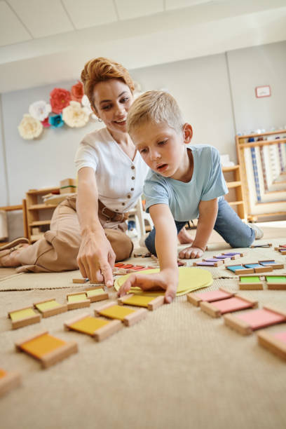 Engaging Montessori teacher guides boy in playful learning activities