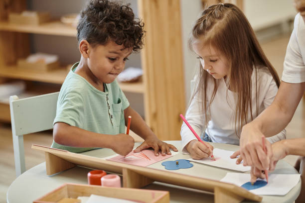 istock Engaging Montessori lessons with a teacher and diverse children exploring creative activities 2173880746