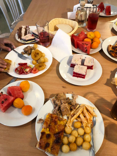 istock Dinner with a main meat dish, dessert and fruit on the table. 2173881060
