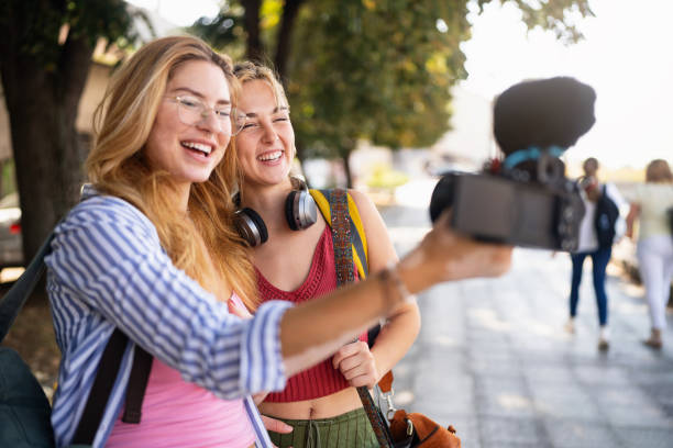 istock Modern female influencers, using camera to record their experience in the city they visiting, for their travel vlog 2173883341