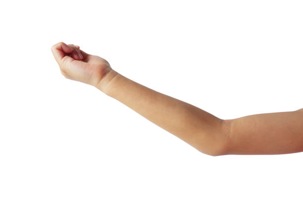 A small child's hand is making a gesture showing his hand up on a white background.
