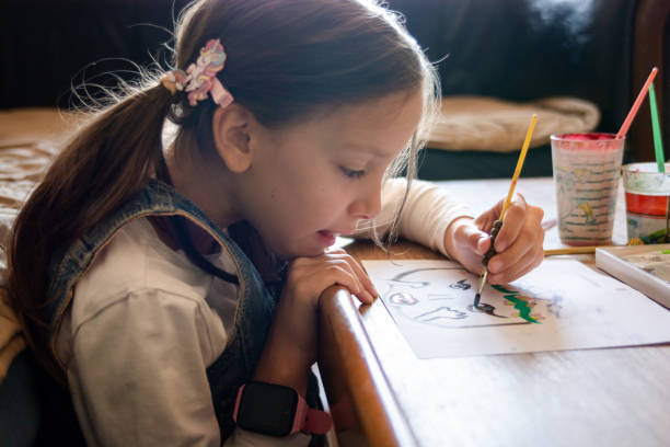 istock Girl drawing whit watercolors 2173885233