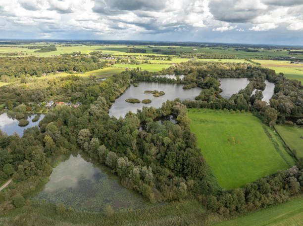 istock IJssel landscape with clouds above 2173888326