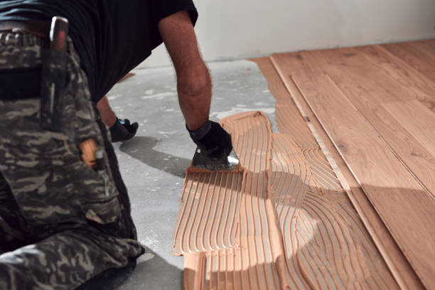 istock Professional handyman installing laminate flooring in a new apartment. 2173888415