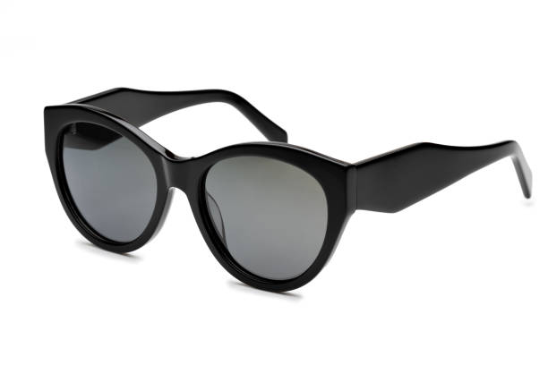 istock Cat eye sunglasses with a thick black frame are laying on a white background 2173889189