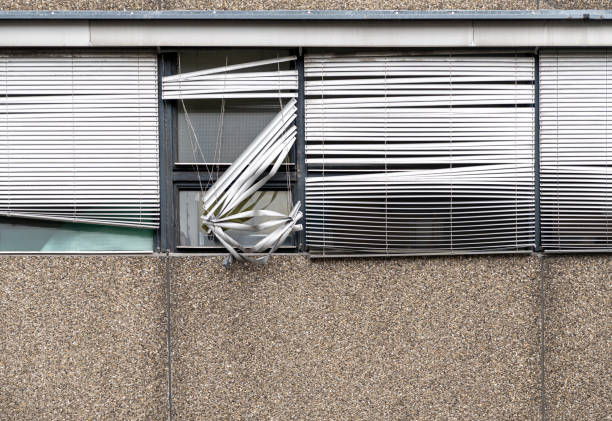 Germany, Berlin, Steglitz, August 08, 2024 -Close-up of windows with broken blinds on a residential building