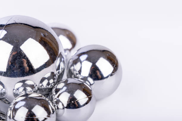 istock Silver Christmas decorations with balls of various sizes on a white background 2173893536