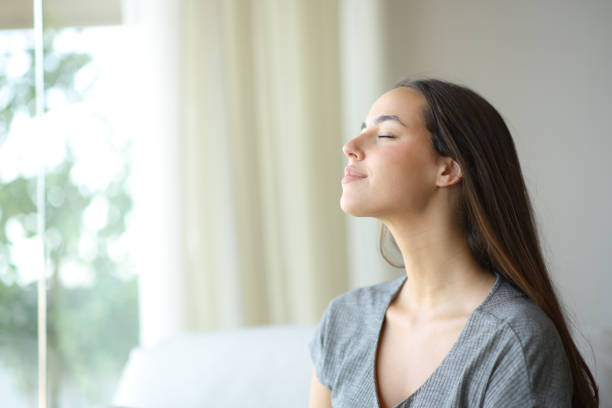 istock Woman breathing on a sofa at home 2173893790