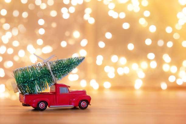 Vintage Red Car Carrying a Christmas Ornament