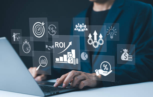 istock Analyzing ROI and Business Strategy Concepts. Businessman working on a laptop with various digital icons representing ROI, financial strategies, return on investment, and efficiency. marketing plan, 2173901280