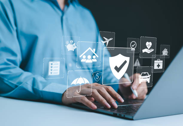 istock Insurance concept. A person using a laptop with various digital icons representing different types of insurance, such as health, home, car, travel, comprehensive coverage, and policy management. 2173901333