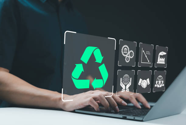 istock Recycle icon, Sustainable Development Concept. Person using a laptop with recycling icon, surrounded by various sustainability symbol, concepts of eco-friendly practices and sustainable development 2173901337