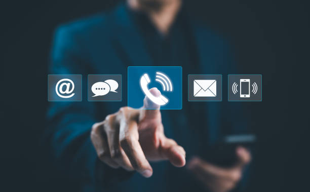 istock Customer Service Call Center, Contact US, Care Support Hotline, Hand touches glowing digital phone icon among various communication symbols, representing customer service and multiple contact methods. 2173901367