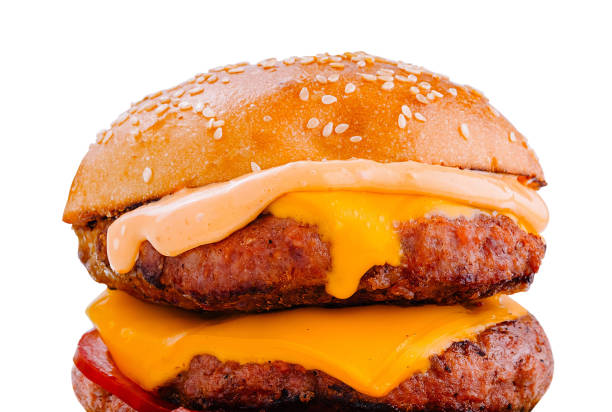 istock Delicious burger with melted cheese and sauce dripping down 2173901711