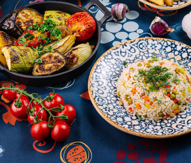 istock Colorful and flavorful vegetarian dinner is served on a table with a blue tablecloth 2173901849