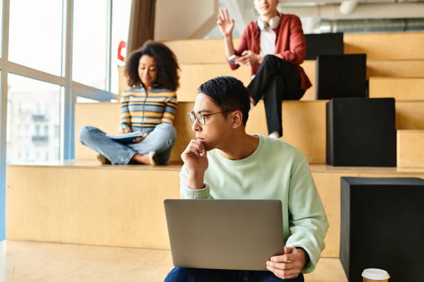 istock Diverse university students collaborate on assignments while gathering on classroom stairs 2173902636
