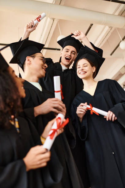 istock Diverse university students joyfully celebrating graduation together 2173903106
