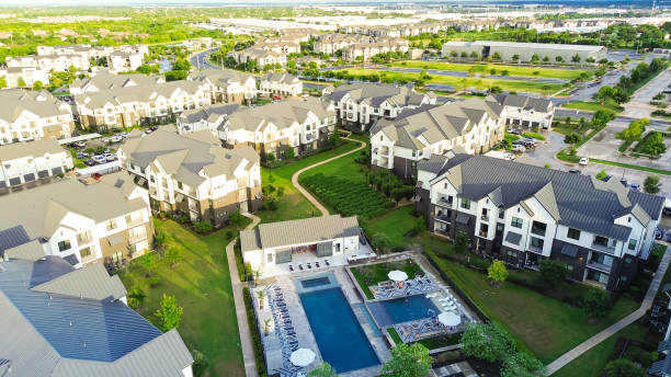 istock Modern swimming pool and spa in new development apartment complex with metal roofing, siding in fast growing area near Pflugerville northeast of downtown Austin, Texas, housing market, aerial 2173905142