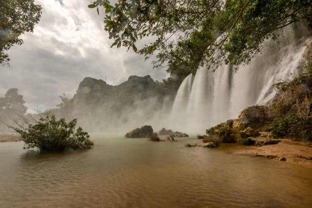 Ban Gioc waterfall in Cao Bang, Viet Nam - The waterfalls are located in an area of mature karst formations were the original limestone bedrock layers are being eroded