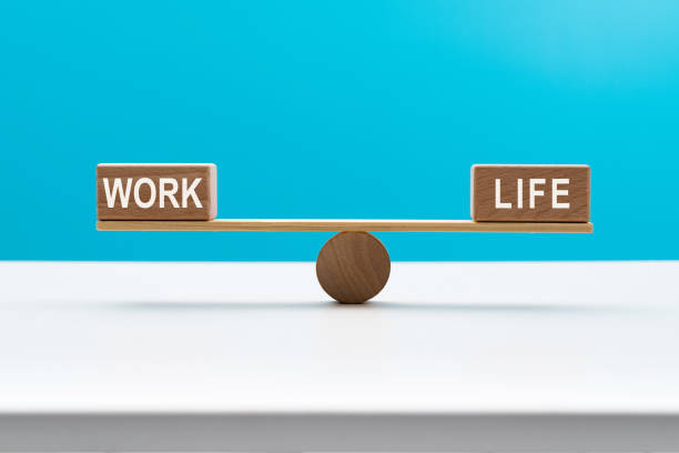 istock Wooden seesaw with word life and work 2173910036