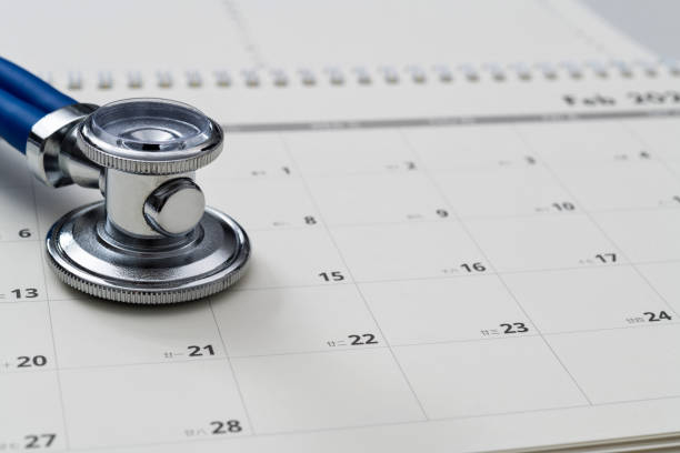 istock Stethoscope and pen on a calendar 2173910194