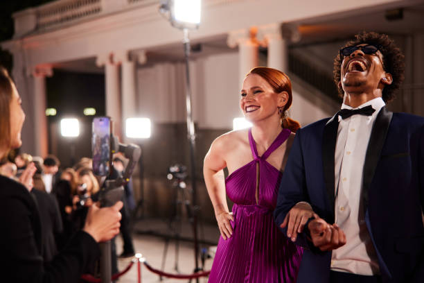 istock The influencer is live-streaming red-carpet interviews with leading actors. 2173911797
