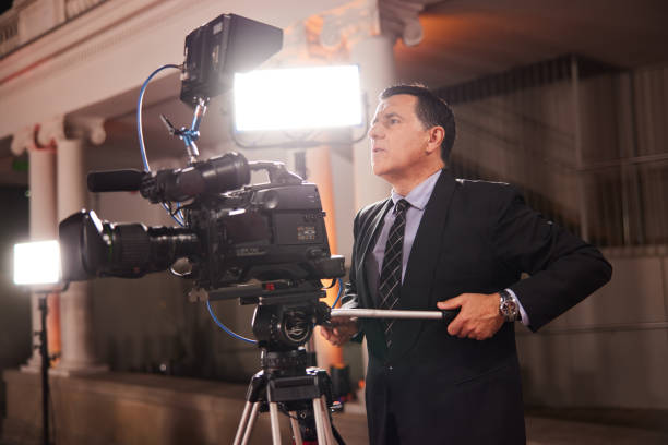 professional video camera on a crane covering an outdoor event