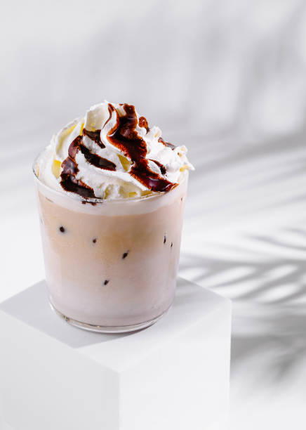 istock Iced coffee with whipped cream and chocolate sauce on white background 2173912650